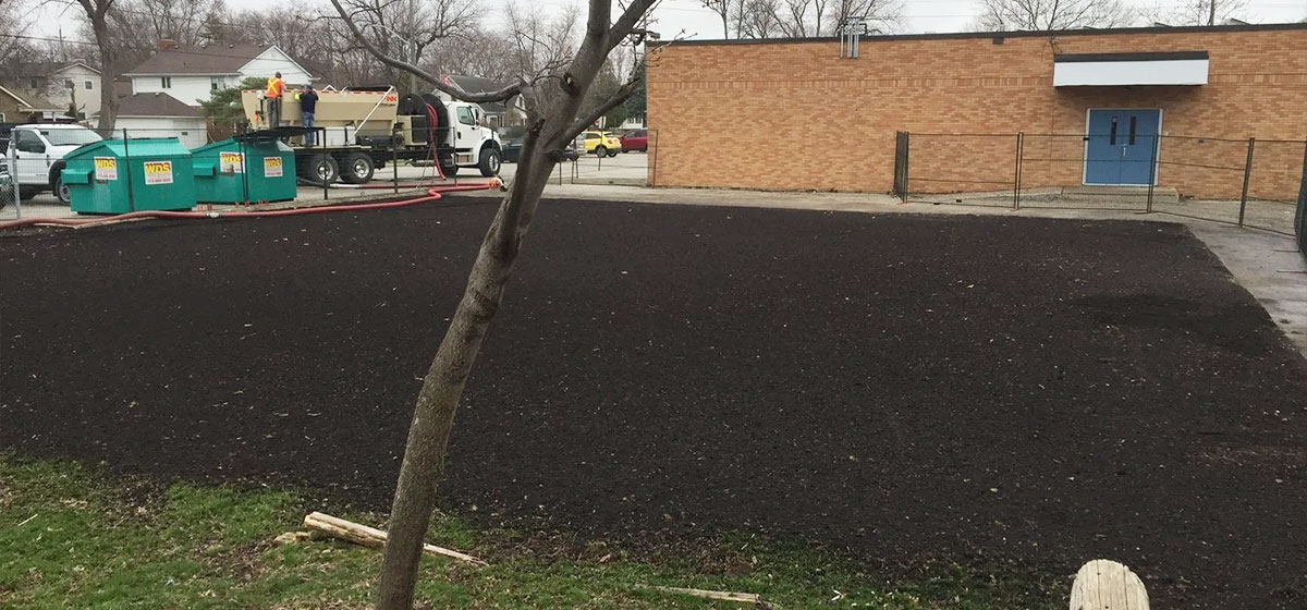 Large-scale topsoil installation and site preparation by the Quality Turf landscaping crew at St. Pius X Catholic Elementary School in Tecumseh, Ontario.